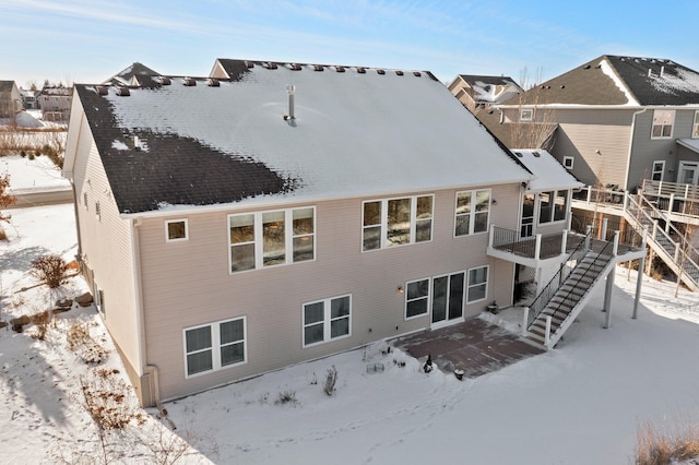 view of snow covered house