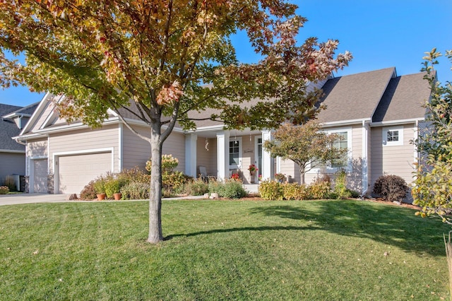 view of front facade featuring a garage and a front lawn