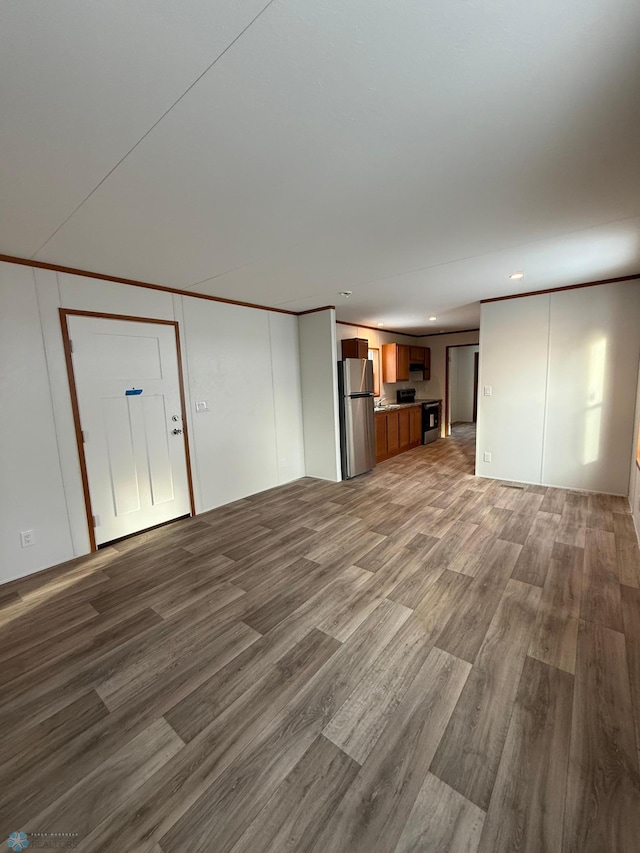 unfurnished living room with hardwood / wood-style floors