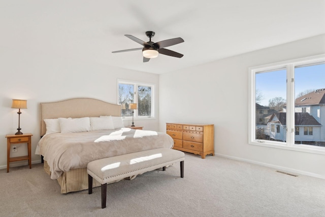 carpeted bedroom featuring ceiling fan