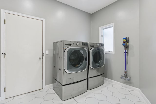 laundry room with washing machine and dryer