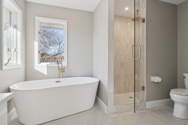 bathroom with toilet, independent shower and bath, and tile patterned flooring