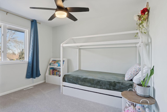 carpeted bedroom with ceiling fan