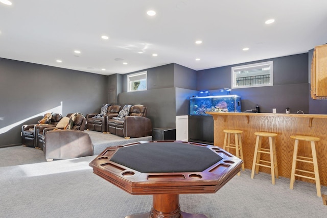 playroom featuring light carpet and bar