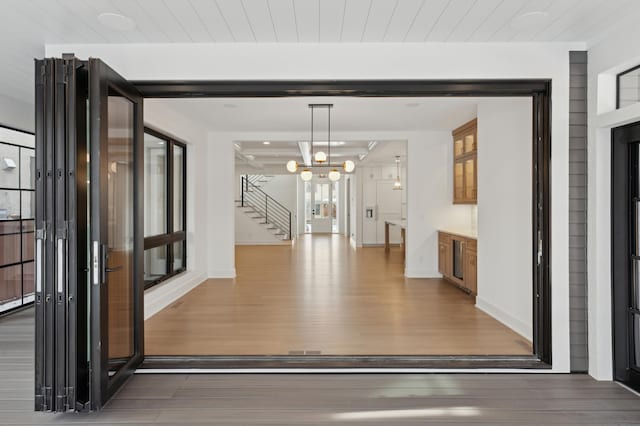 interior space featuring hardwood / wood-style flooring and a chandelier