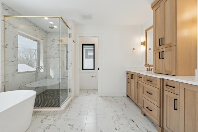 bathroom with vanity and shower with separate bathtub