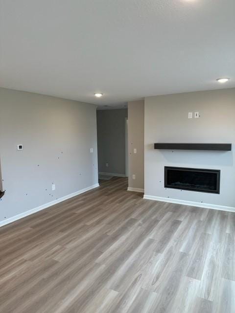 unfurnished living room featuring light hardwood / wood-style flooring