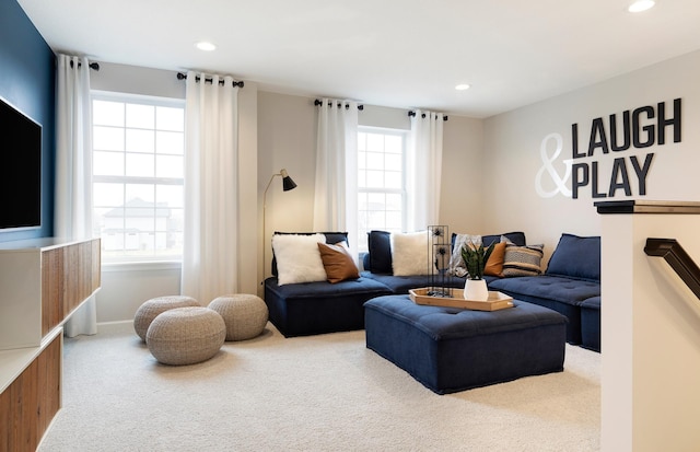 carpeted living area featuring recessed lighting