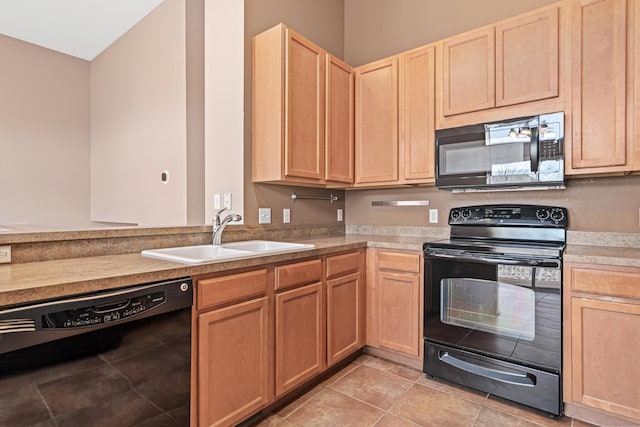 kitchen featuring light tile patterned flooring, light brown cabinets, a sink, light countertops, and black appliances