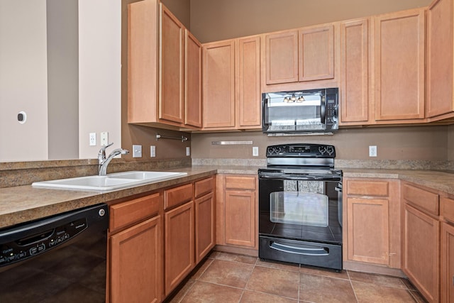 kitchen with black appliances, light tile patterned flooring, a sink, and light countertops