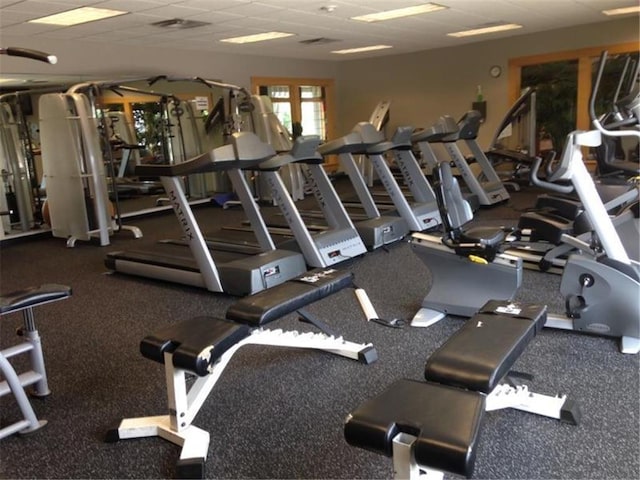 gym featuring a drop ceiling