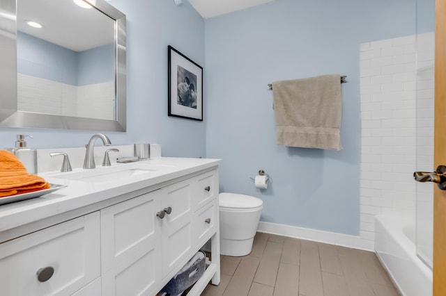 full bathroom featuring vanity, toilet, and tiled shower / bath combo