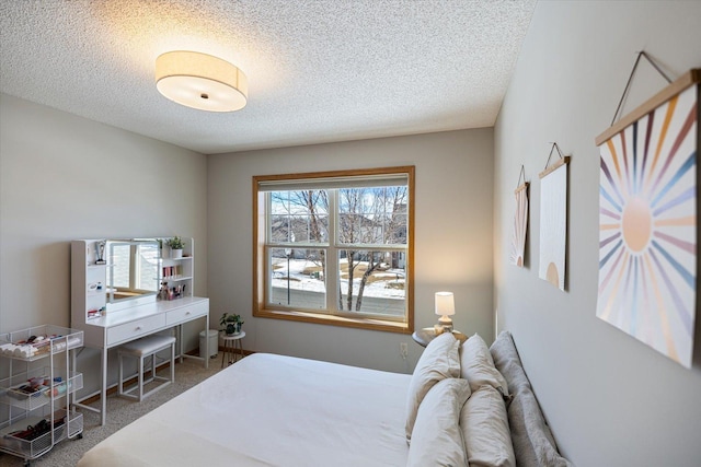 bedroom with carpet flooring and a textured ceiling