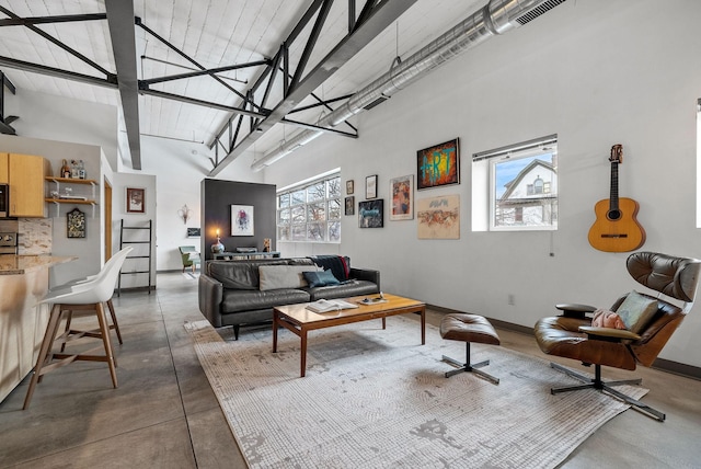 living room with a towering ceiling and a wealth of natural light