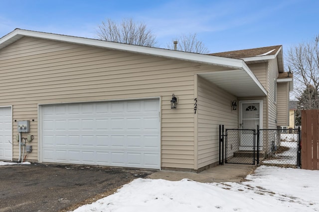 view of snow covered garage