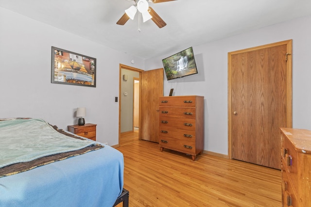 bedroom with ceiling fan and light wood-type flooring