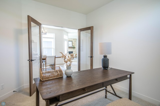 carpeted office space with french doors