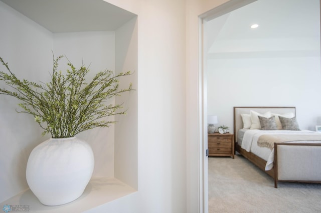 bedroom featuring light colored carpet