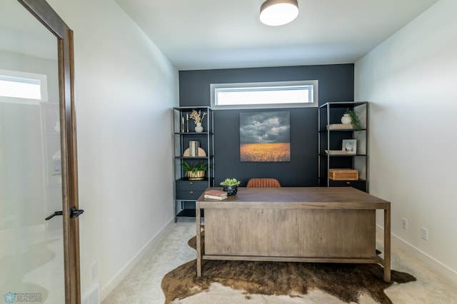 carpeted office with visible vents and baseboards