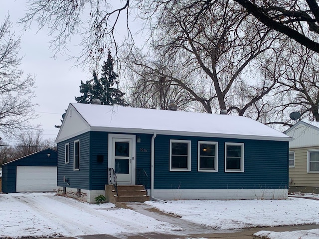 view of front of home with an outbuilding and a garage