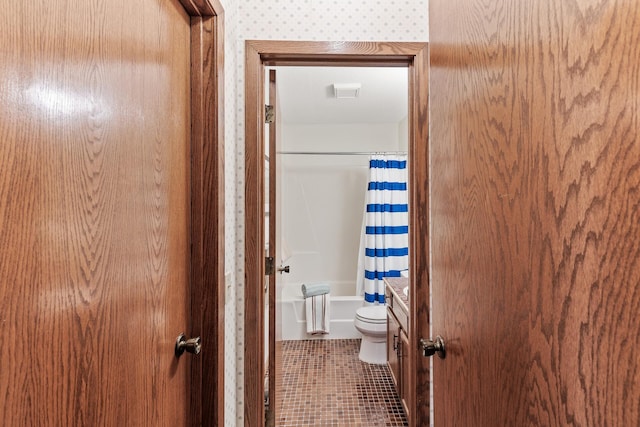 bathroom with tile patterned flooring, toilet, and shower / bathtub combination with curtain