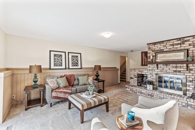 carpeted living room with a brick fireplace