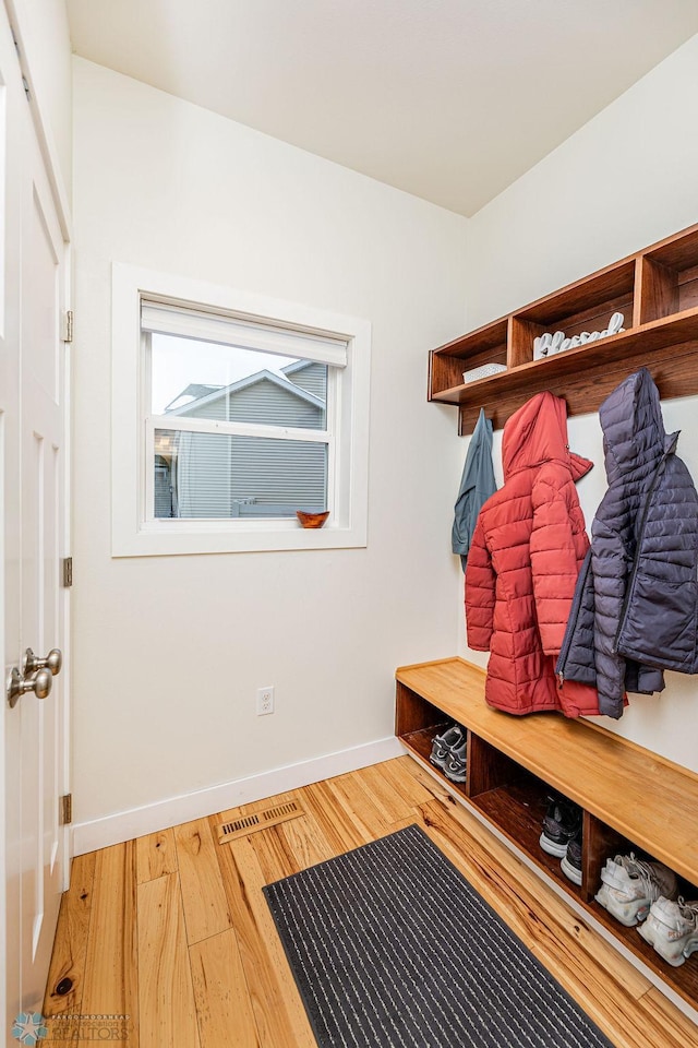 mudroom with hardwood / wood-style floors