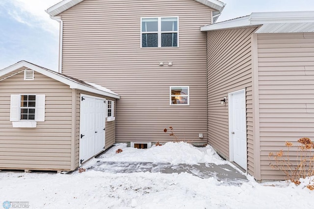 view of snow covered house