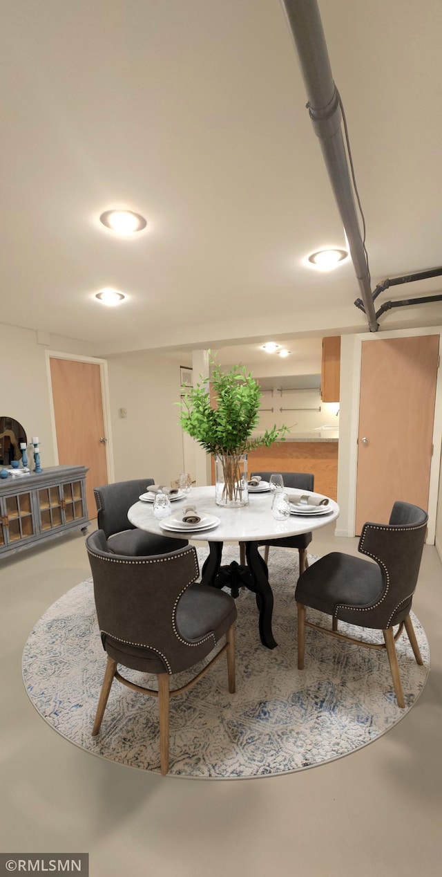 dining room with concrete floors