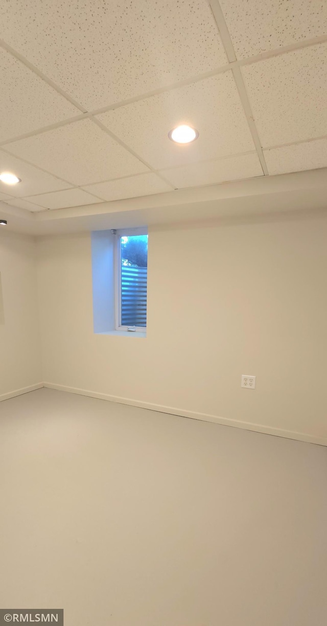 basement featuring a paneled ceiling