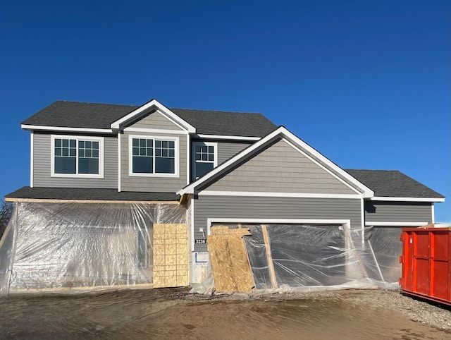 view of front of property with a garage