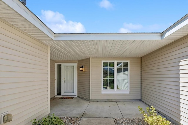 property entrance featuring a patio