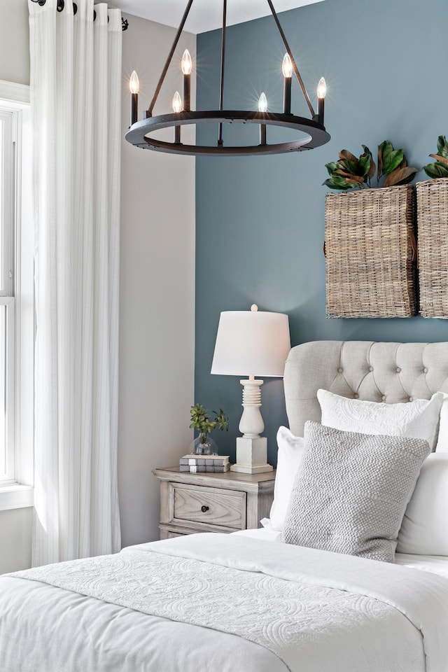 bedroom featuring a chandelier