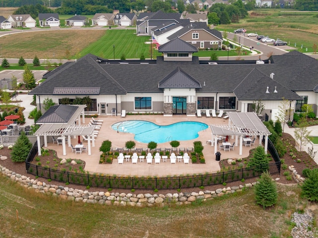 view of swimming pool with a pergola and a patio