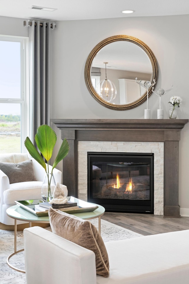 room details with an inviting chandelier and wood-type flooring