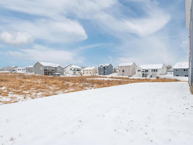 view of yard layered in snow