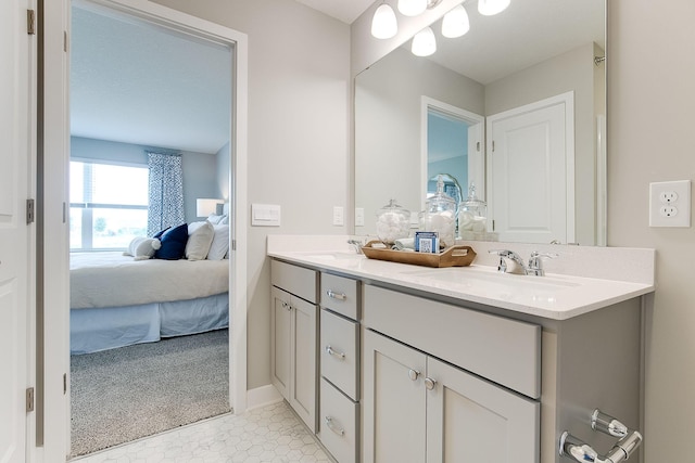 bathroom with tile patterned flooring and vanity