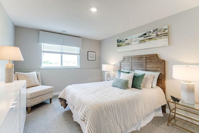 bedroom featuring light carpet