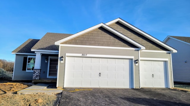 craftsman-style home with a garage