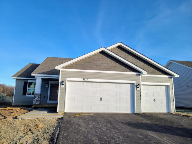 craftsman-style home featuring a garage