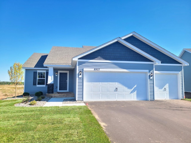 craftsman-style house with a garage and a front yard