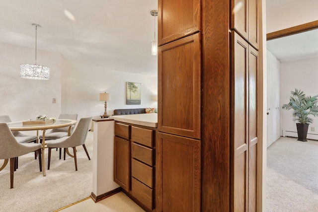 kitchen with decorative light fixtures, light colored carpet, and an inviting chandelier