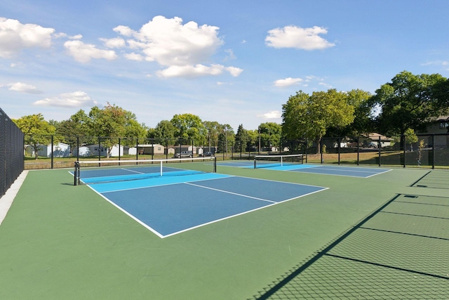 view of tennis court with basketball hoop