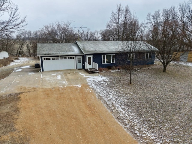 ranch-style home with a garage