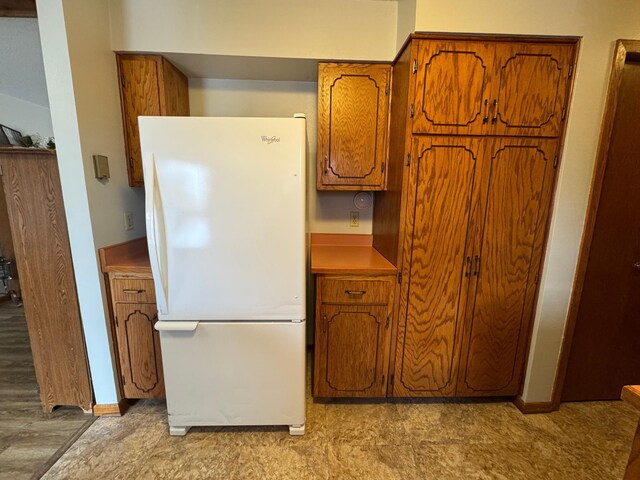 kitchen featuring white fridge and light hardwood / wood-style floors