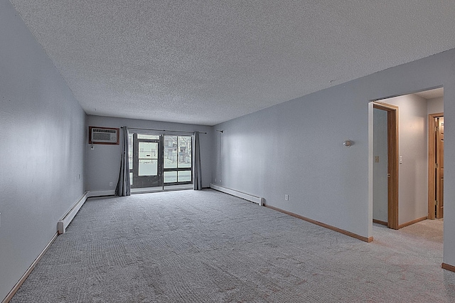 unfurnished room featuring an AC wall unit, a baseboard heating unit, and light colored carpet