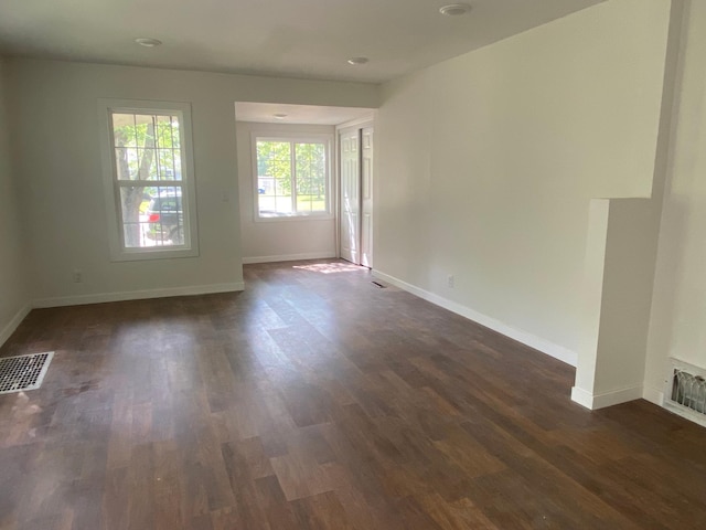 empty room featuring dark hardwood / wood-style flooring