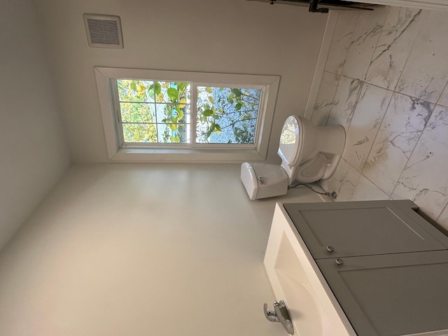 bathroom with toilet and vanity