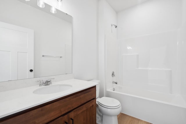 full bathroom featuring vanity, toilet, shower / bathtub combination, and hardwood / wood-style floors