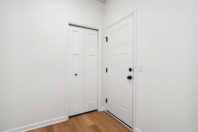 doorway with light wood-type flooring